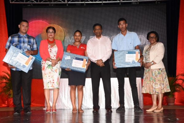 The three achievers in a souvenir photograph with President Faure, Minister Mondon and Minister Telemaque